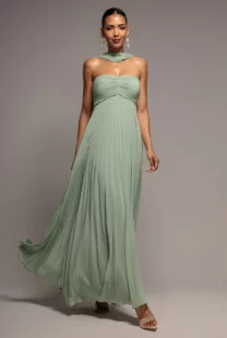 Fresh elegance meets effortless versatility in the Goddiva Sleeveless Pleated Chiffon Multiway Scarf Maxi Dress in Sage Green. Designed with a flowing A line silhouette, this Sage Green maxi dress features a pleated chiffon finish and a multiway scarf detail that can be styled to suit any occasion.